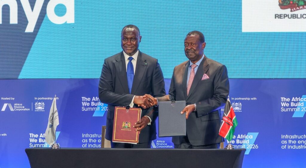 AFC President and CEO Samaila Zubairu and Kenya's Prime Cabinet Secretary Musalia Mudavadi sign the Host Country Agreement establishing AFC's first regional office in Nairobi, as President William Ruto looks on during the AFC Annual General Meeting.