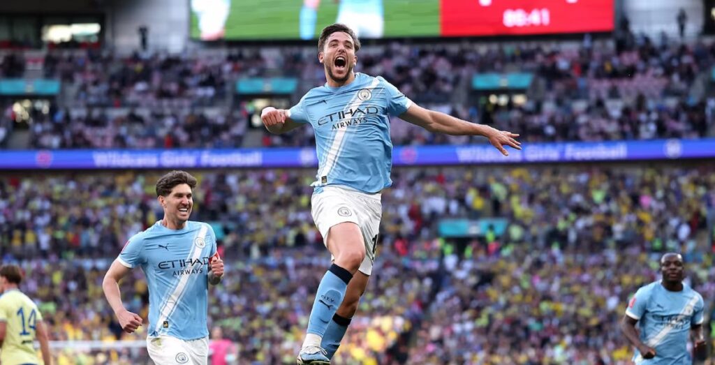 Manchester City players mob Nico González after his stunning long-range strike sealed a 2-1 FA Cup semi-final win over Championship side Southampton at Wembley