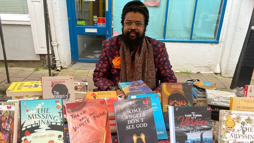 Nigerian author and filmmaker Onyeka Nwelue pictured with some of his more than 40 published books