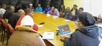 Eswatini National Trust Commission officials meet with traditional leaders and Matsanjeni North Inkhundla constituency Member of Parliament Phila Buthelezi. Photo by ENTC