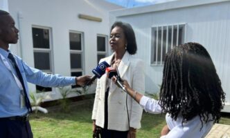 Newly elected Mozambican Bar Association President Thera Tobias Dai speaks to the media