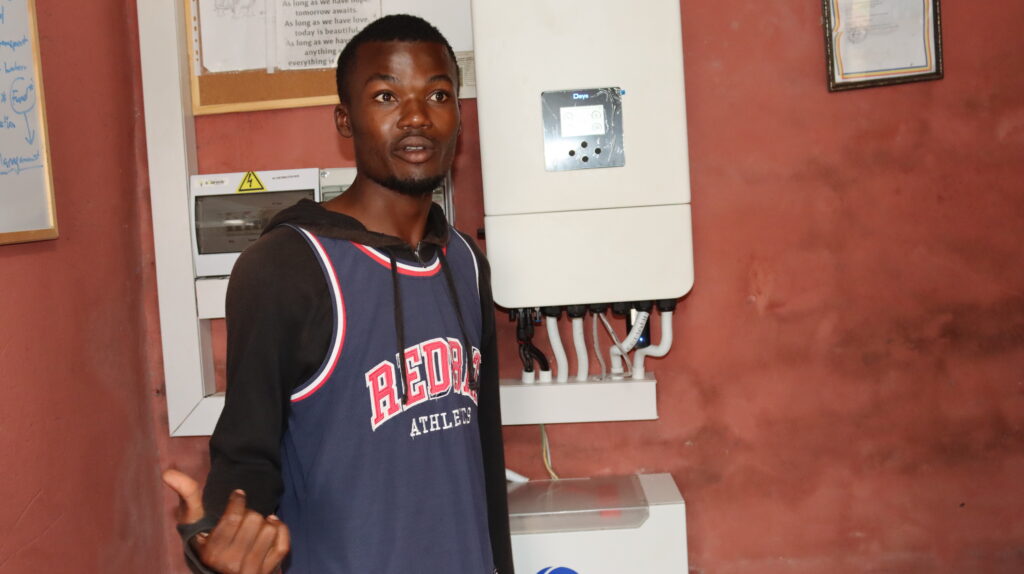 Ayanda Shongwe next to the solar system that will power his incubator and keep his chicks warm. UNDP Eswatini/Mantoe Phakathi