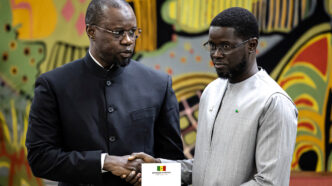 Discord has grown between Senegal's now-dismissed Prime Minister Ousmane Sonko (L) and President Bassirou Diomaye Faye (R) pictured during an 2025 event in Dakar. © Patrick Meinhardt, AFP