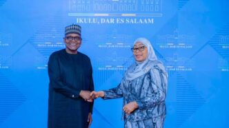 Tanzanian President Samia Suluhu Hassan and Dangote Industries Limited President and CEO Aliko Dangote shake hands during high-level discussions on industrialisation, regional energy infrastructure, and long-term economic development across Africa.