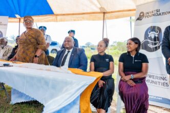 Inyatsi Group Marketing and Public Relations Manager Ncobile Dlamini and other Foundation representatives walk alongside the Deputy Prime Minister Thulisile Dladla during the official opening of the Hlobane and Madelezini Care Points in Mayiwane.