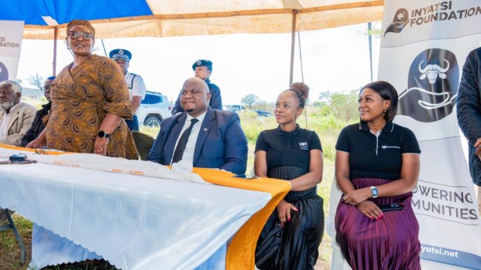 Inyatsi Group Marketing and Public Relations Manager Ncobile Dlamini and other Foundation representatives walk alongside the Deputy Prime Minister Thulisile Dladla during the official opening of the Hlobane and Madelezini Care Points in Mayiwane.