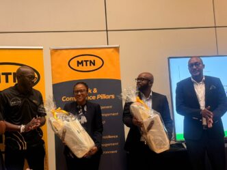 NDRMA Information and Knowledge Management Officer Ntabeni Msibi receives gifts from MTN Eswatini CEO Jerry Soko and MTN Fintech CEO Sam Shongwe following the Authority's disaster preparedness presentation during MTN Eswatini's Business Continuity Awareness Week.