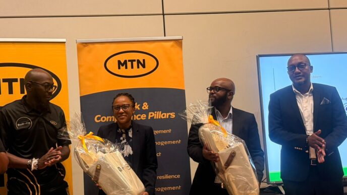 NDRMA Information and Knowledge Management Officer Ntabeni Msibi receives gifts from MTN Eswatini CEO Jerry Soko and MTN Fintech CEO Sam Shongwe following the Authority's disaster preparedness presentation during MTN Eswatini's Business Continuity Awareness Week.