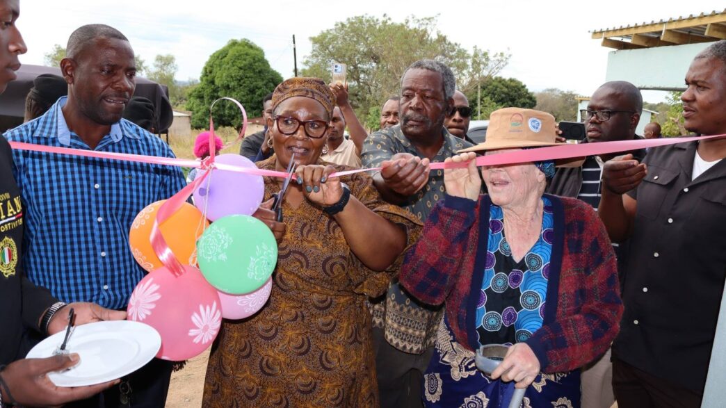 Deputy Prime Minister Thulisile Dladla cuts the ribbon during the official opening of one of the two newly built Neighbourhood Care Points handed over to communities under Mayiwane Inkhundla on Wednesday.