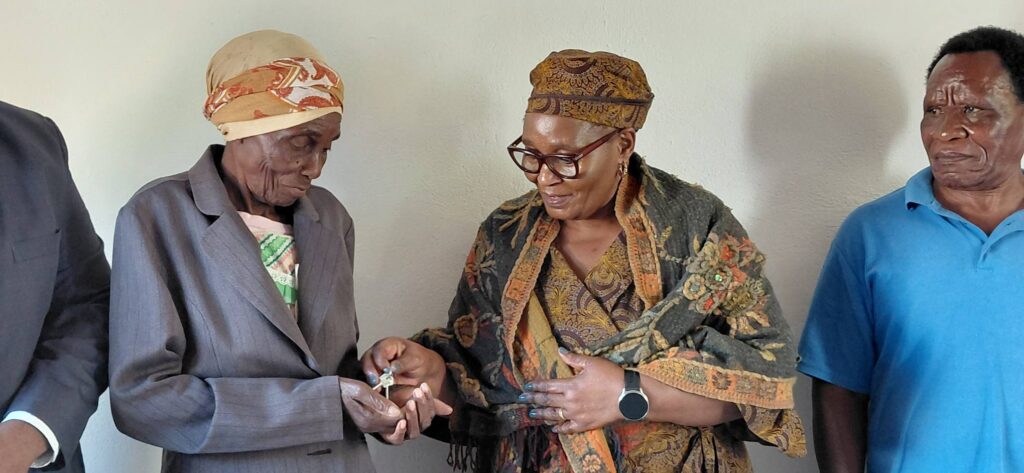 Deputy Prime Minister Thulisile Dladla hands over the keys to one of the four newly constructed houses delivered to vulnerable beneficiaries as part of the government's decent housing initiative in Mayiwane on Wednesday.
