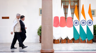 Japanese Foreign Minister Toshimitsu Motegi (left) walks with Indian External Affairs Minister Subrahmanyam Jaishankar during bilateral talks in New Delhi on Monday. | Photo: MoFA Japan