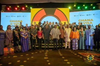 Ghanaian President John Dramani Mahama poses with government officials and stakeholders at the launch of Ghana's electronic visa portal, a move that scraps visa fees for all African passport holders visiting the country for business or tourism.
