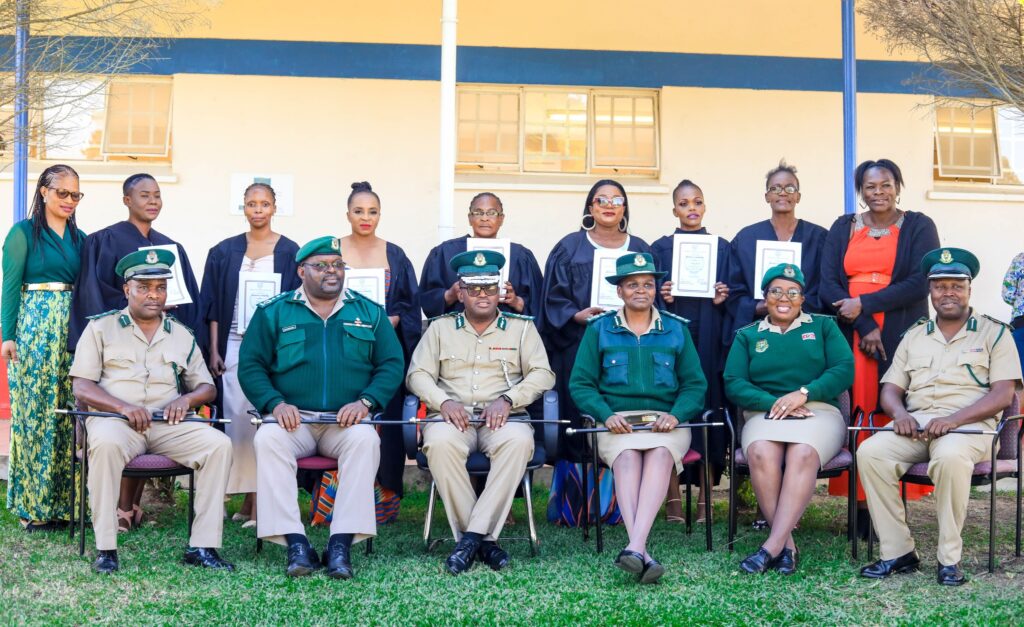 Graduates and officials pose for a group photo during the Basic Computer Skills graduation ceremony for women inmates from Mawelawela Correctional Centre, held at Southern Africa Nazarene University (SANU) in Manzini. Photo by HMCS