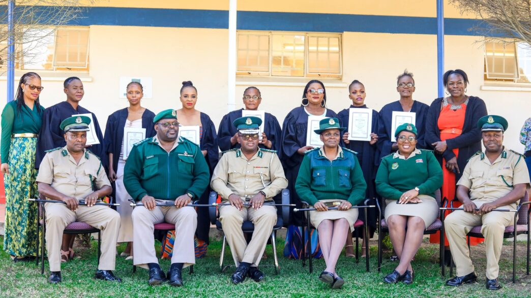 Graduates and officials pose for a group photo during the Basic Computer Skills graduation ceremony for women inmates from Mawelawela Correctional Centre, held at Southern Africa Nazarene University (SANU) in Manzini. Photo by HMCS