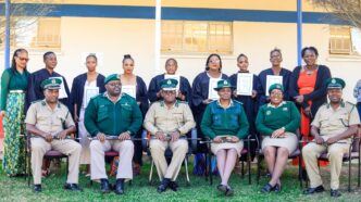 Graduates and officials pose for a group photo during the Basic Computer Skills graduation ceremony for women inmates from Mawelawela Correctional Centre, held at Southern Africa Nazarene University (SANU) in Manzini. Photo by HMCS