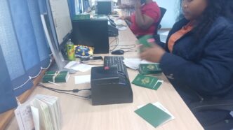 A Home Affairs official processes travel documents at one of the ministry's offices as the government moves to clear a passport backlog affecting thousands of Emaswati. Photo: Ministry of Home Affairs