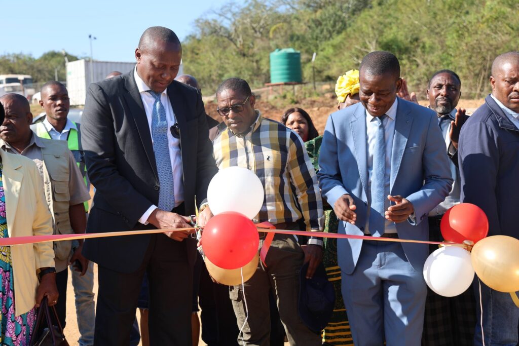Prime Minister Russell Mmiso Dlamini cuts the ribbon to officially commission one of several government-funded projects during his tour of the Sandleni, Mtsambama and Kumethula Tinkhundla in the Shiselweni Region. | Photo: Eswatini Government