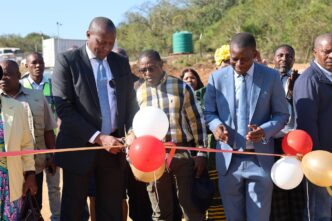 Prime Minister Russell Mmiso Dlamini cuts the ribbon to officially commission one of several government-funded projects during his tour of the Sandleni, Mtsambama and Kumethula Tinkhundla in the Shiselweni Region. | Photo: Eswatini Government