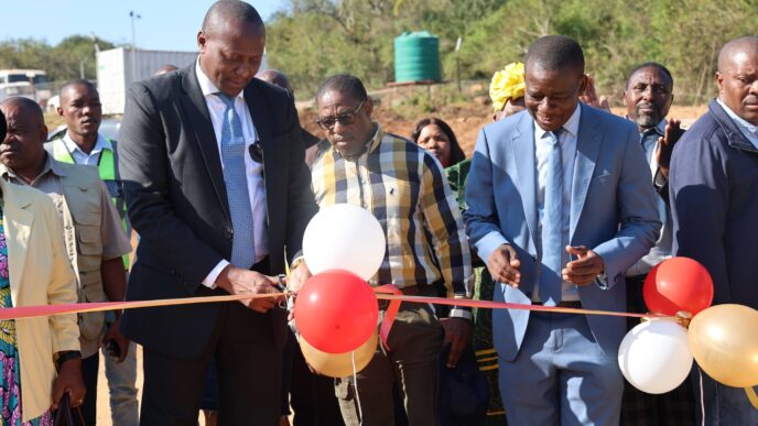 Prime Minister Russell Mmiso Dlamini cuts the ribbon to officially commission one of several government-funded projects during his tour of the Sandleni, Mtsambama and Kumethula Tinkhundla in the Shiselweni Region. | Photo: Eswatini Government