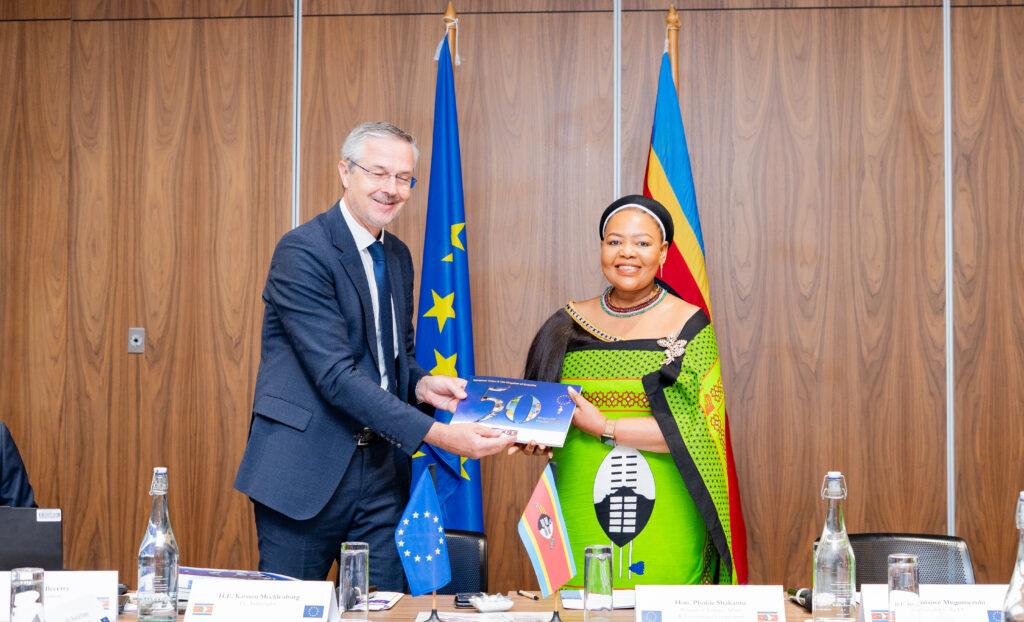 EU Ambassador H.E. Karsten Mecklenburg presents a commemorative booklet marking 50 years of EU partnership to Minister of Foreign Affairs Senator Pholile Shakantu during the 3rd Eswatini-EU Partnership Dialogue in Mbabane. Photo by Phindokuhle Sithole/Lokuhle Media