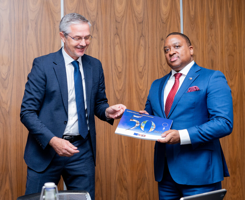 EU Ambassador H.E. Karsten Mecklenburg presents a commemorative booklet marking 50 years of EU partnership to Eswatini Ambassador to Belgium Sibusisiwe Mngomezulu during the 3rd Eswatini-EU Partnership Dialogue in Mbabane. Photo by Phindokuhle Sithole/Lokuhle Media