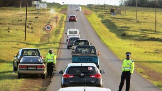 Eswatini police officers staging a roadblock.