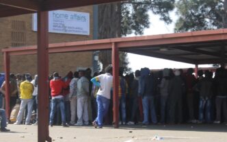 Hundreds of people, some asylum seekrs, queueing outside home affairs offices in Marabastad. Photo: Thabang Kuaho