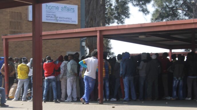 Hundreds of people, some asylum seekrs, queueing outside home affairs offices in Marabastad. Photo: Thabang Kuaho