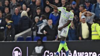 Manchester City winger Jeremy Doku celebrates after scoring his second goal of the night to earn City a 3-3 draw against Everton at Hill Dickinson Stadium in Liverpool. Photo by Getty Images