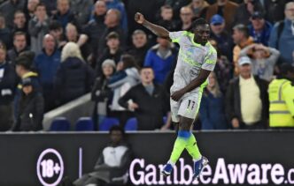 Manchester City winger Jeremy Doku celebrates after scoring his second goal of the night to earn City a 3-3 draw against Everton at Hill Dickinson Stadium in Liverpool. Photo by Getty Images