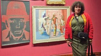 Photo: Maria McCloy pictured at a gallery, exuding the style and cultural flair she was celebrated for throughout her career. | Photo credit: Facebook