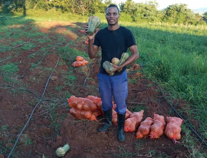 Herbet Zikhali Ncube with his butternut harvest in Lobamba Lomdzala. (Photo: Eswatini National Youth Council)
