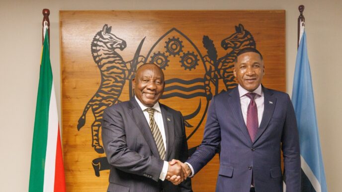 Botswana President Duma Boko and South African President Cyril Ramaphosa shake hands at the Office of the President in Botswana