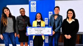 Peace Farm founder Katleho Mpopo displays her M62,000 Lesotho Innovation Challenge cheque alongside stakeholders. | Photo: NUL Research and Innovations