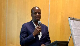 Director of Community Based Natural Resources Management (CBNRM) in Botswana's Ministry of Environment and Tourism, Mr. Kealeboga Kemoreile, addresses stakeholders during a consultative meeting on the CBNRM Act of 2025 held in Maun.