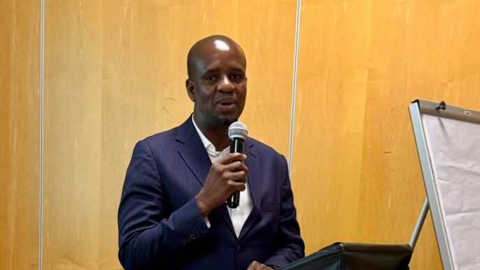 Director of Community Based Natural Resources Management (CBNRM) in Botswana's Ministry of Environment and Tourism, Mr. Kealeboga Kemoreile, addresses stakeholders during a consultative meeting on the CBNRM Act of 2025 held in Maun.