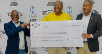 Officials from the Eswatini Olympic and Commonwealth Games Association (EOCGA) and Basketball Eswatini pose with the E490,000 cheque during the official launch of the Development of National Sports System (DNSS) Programme, funded through Olympic Solidarity.