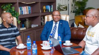 Leap Taxi App director Vusani Matsebula presents the Zanzibar trip itinerary to the Minister of Commerce, Industry and Trade during a courtesy visit by A Peculiar People chairman Melusi Zox Dlamini
