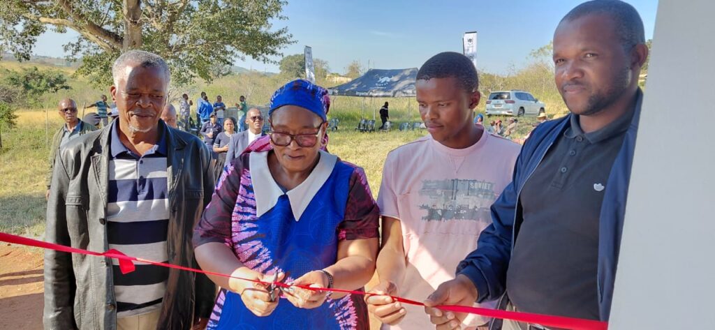 DPM Thulisile Dladla cuts the ribbon of one of the houses. Photos by DPM's Office