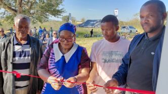 DPM Thulisile Dladla cuts the ribbon of one of the houses. Photos by DPM's Office