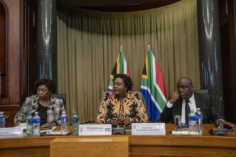 Defence minister Angie Motshekga, justice minister Mmamoloko Kubayi, and deputy home affairs minister Njabulo Nzuza brief the media after a closed-door meeting about illegal immigration. Photo: Ihsaan Haffejee