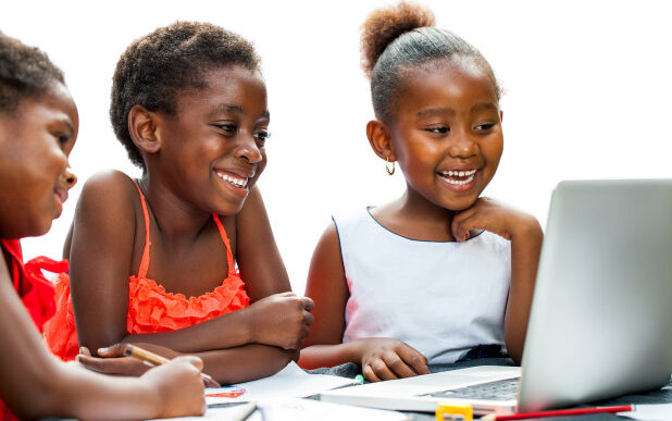 A photo of children on a computer. Photo: Gradely