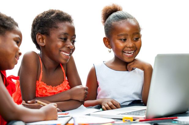 A photo of children on a computer. Photo: Gradely