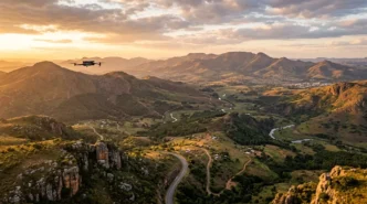 A drone hovers over a landscape