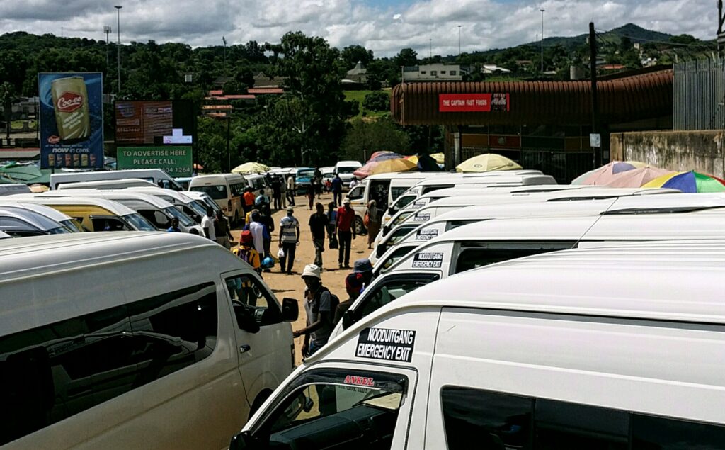 A view of the Manzini bus rank with public transport. Photo by Kirby P