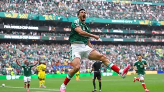 Mexico's Raúl Jiménez, celebrates his second-half goal with Gilberto Mora. Pawel Kopczynski/Reuters