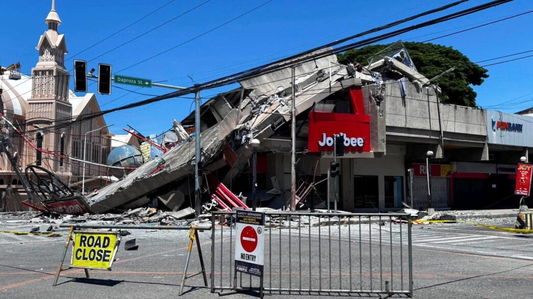 A road is blocked near the collapsed building after a magnitude 7.8 quake in General Santos, Philippines, June 8, 2026. Picture taken with a mobile phone. REUTERS/Edwin Espejo