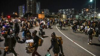 Malawian nationals arrive in large numbers at a repatriation centre in Durban’s city centre on 23 June, ahead of their voluntary return to Malawi. (Photo: Felix Dlangamandla)