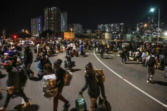 Malawian nationals arrive in large numbers at a repatriation centre in Durban’s city centre on 23 June, ahead of their voluntary return to Malawi. (Photo: Felix Dlangamandla)