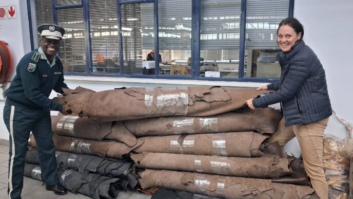 Nakara Managing Director Max Schaefes hands over leather valued at N$100,000 to Namibian Correctional Service Deputy Commissioner-General for Correctional Operations Sam Shaalulange during a handover ceremony in Windhoek. (Photo: Namibian Correctional Service)